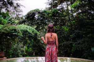 Having an evening drink by the pool at Sandat Glamping Resort in Ubud.