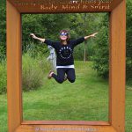 Me jumping in mid air at Sculpture by the Lakes in Dorset