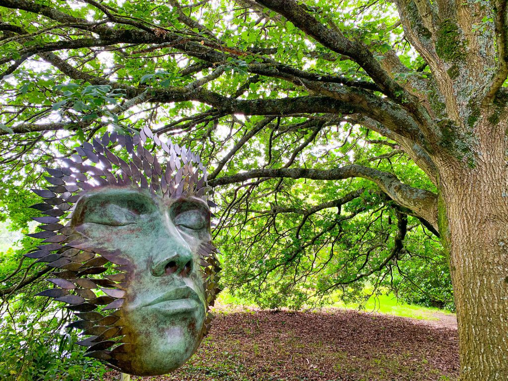 An image of the sculpture Oberon under trees